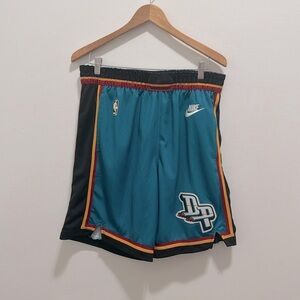 Large Detroit Pistons teal throwback basketball shorts.